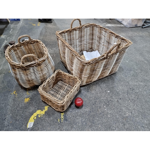 597 - A selection three woven wicker baskets, in a variety of shapes and sizes. Including one large, doubl... 