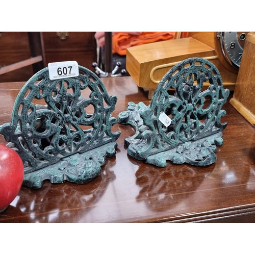 607 - A pair of stunning, cast metal wall mountable corbel shelves featuring green leaf men, and profuse o... 