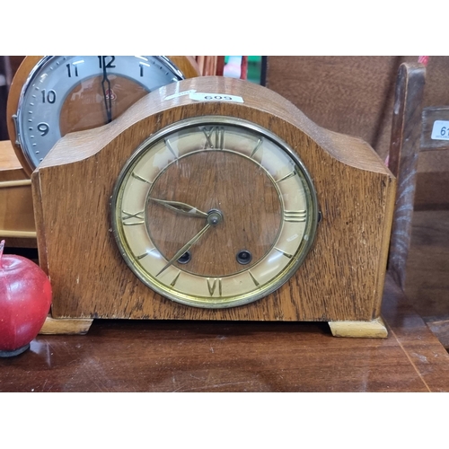 609 - A very nice vintage 8 day chiming clock, set into a golden oak case, with gilded roman numerals agai... 