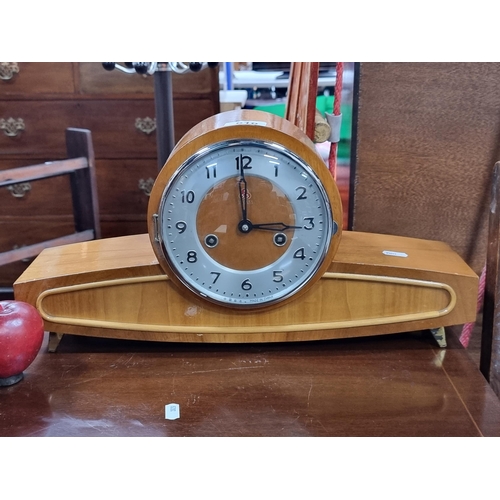 610 - A super cool 555 15 day mantle clock. With a clean chrome bezel, convex glass covering and exaggerat... 