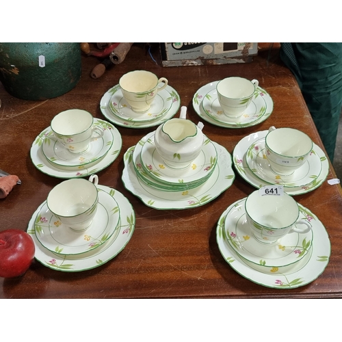 641 - 27 pieces of Delphine china including 6 cups, creamer saucers and side plates.