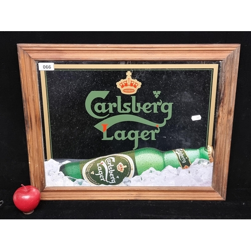 66 - A good advertising mirror for Carlesburg Lager in a wooden frame.