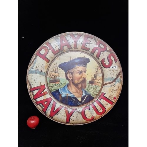 70 - A large circular metal sign advertising Player's Navy Cut cigarettes.