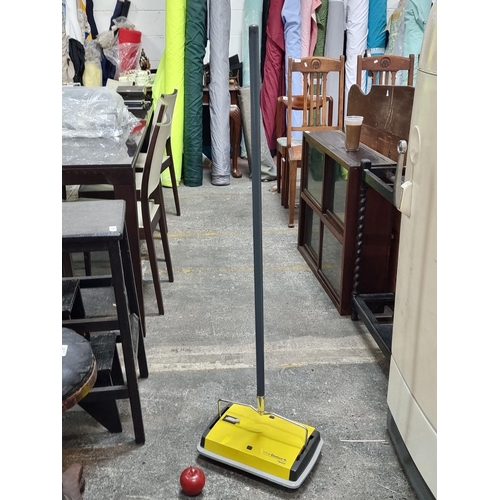 656 - A retro prestige Ewbank 1200 manual carpet cleaner/sweeper in yellow.