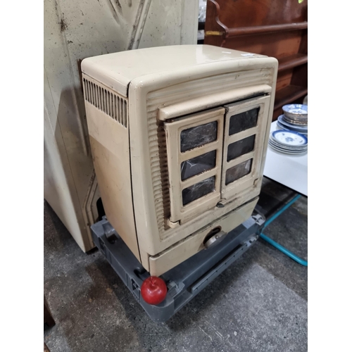 681 - Star lot : A fabulous c.1930s Rayburn Room Heater (pt 12) enamel wood burning stove in a cream finis... 