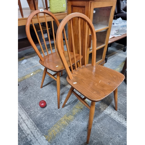 685 - A pair of charming English made occasional chairs with spindles and round back rests.