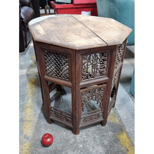 689 - A beautiful antique Anglo-Indian octagonal carved folding table. Features lovely pierced panels to s... 