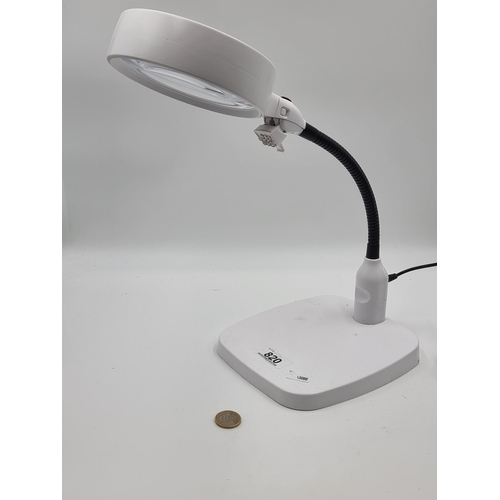 820 - An excellent electric light up large magnifier. Has a great magnification.