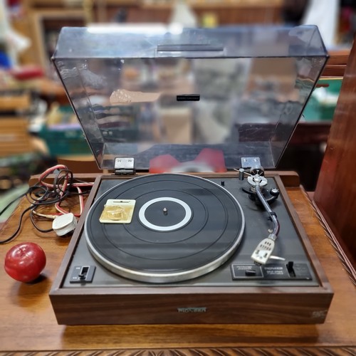 544 - A Pioneer turntable, model PL-120. A stylish example with a wood effect case and a tinted dustcover.... 