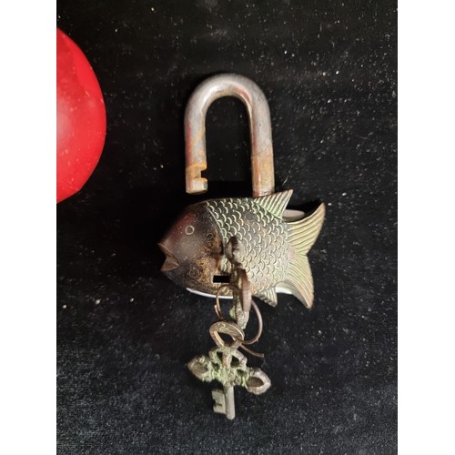 550 - A very antique heavy charming cast brass love padlock in a form of a fish, featuring an intricate in... 