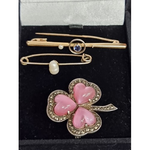 551 - A selection of three beautiful vintage brooches. Including a sterling silver shamrock with marcasite... 