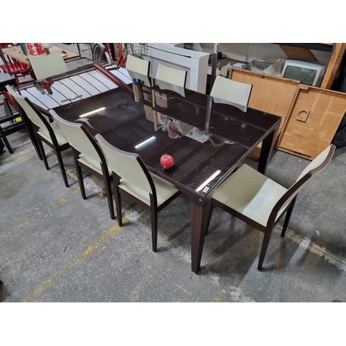 644 - Star lot : A designer Calligaris  sleek modern tempered glass top dining table with tapered legs and... 