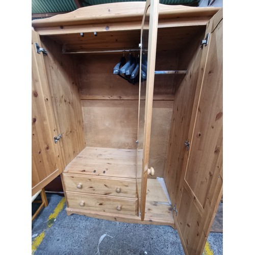 578 - A good wardrobe with a main body with mirror, a side storage with door and two drawers to base. H185... 