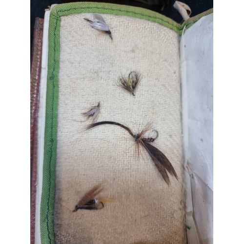 107 - A very interesting pair of genuine leather bound fly fishing wallets, including a H. Whitty Late Edm... 