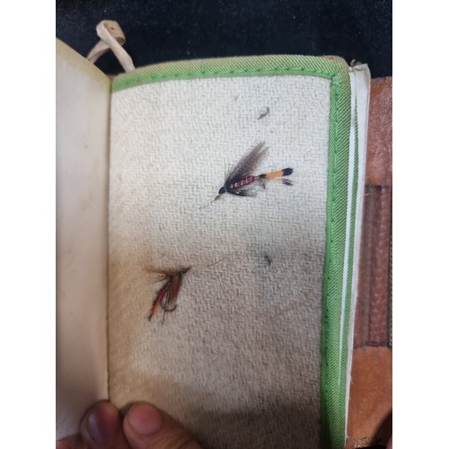 107 - A very interesting pair of genuine leather bound fly fishing wallets, including a H. Whitty Late Edm... 