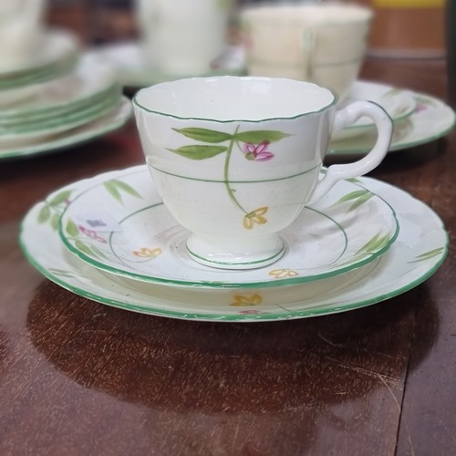 641 - 27 pieces of Delphine china including 6 cups, creamer saucers and side plates.