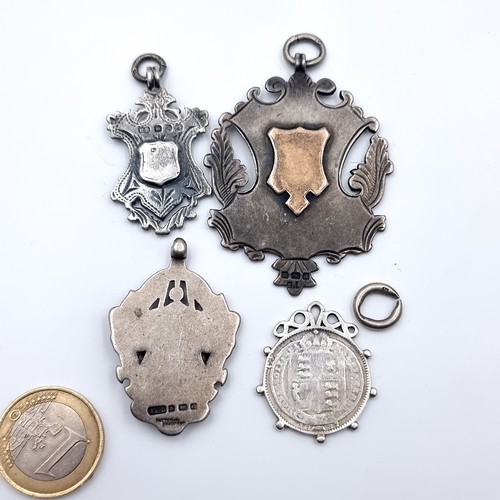 533 - A great collection of four sterling silver medallions, comprising of two 18 Gold inlayed examples. T... 