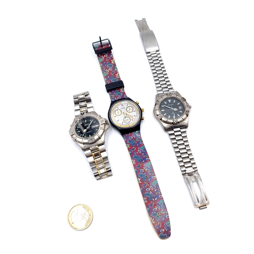 15 - Three wrist watches, consisting of a Swatch example and a Guess water resistant Quartz movement watc... 