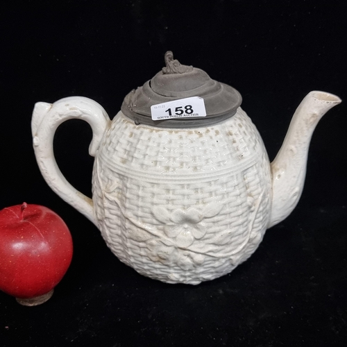 158 - A lovely 19th century  porcelain teapot with an unusual basket weave finish and floral motif overlay... 