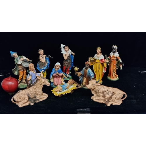 A charming Italian made Nativity set including 11 figures such as Mary ...