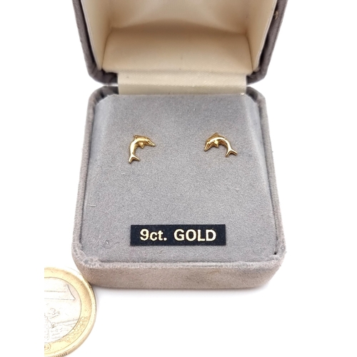 2 - A pretty pair of 9 carat Gold stud earrings, featuring the form of leaping dolphins. Presented in a ... 