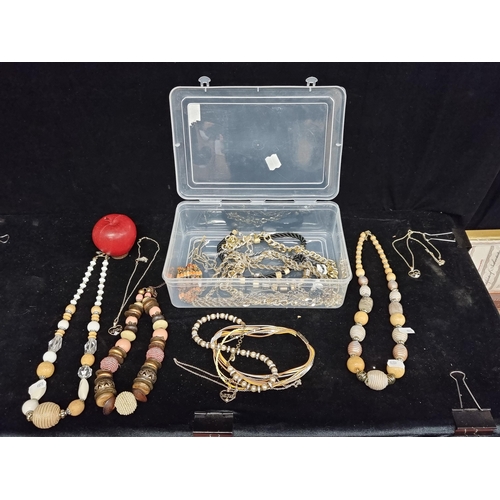 212 - A box of beautiful costume jewellery of a gold tone. With large oversized beaded examples and an unu... 