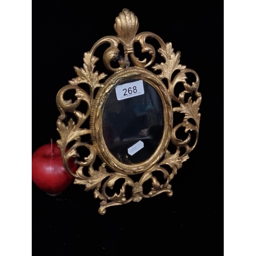 268 - A beautiful, Victorian, gilt metal photo frame. A beautifully ornate example with large foliate scro... 