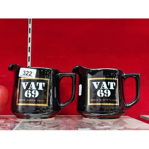 322 - A pair of Vat 69 Finest Scotch Whisky jugs by HCW Scandic. In good condition.