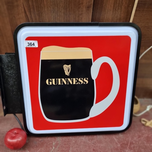 364 - A neatly sized double sided light-up sign, advertising Guinness in shades of red, black and white. W... 