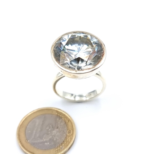 37 - A show stopping brilliant white Moissanite ring, of a huge 22.65 carats and set in sterling silver. ... 