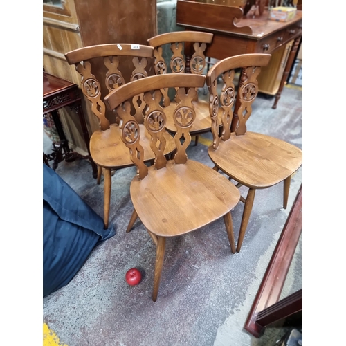 473 - Star Lot : Four vintage, well made and charming Ercol dining chairs with three panel splat backs fea... 