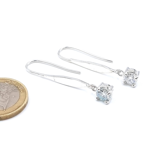 48 - A lovely pair of brilliant white Moissanite drop earrings, of 2 carats and set in sterling silver. S... 