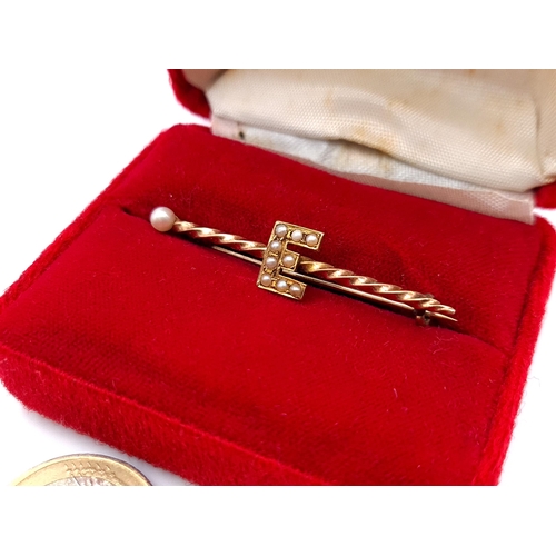 544 - A very nice example of a 9 carat Gold Seed Pearl and twist brooch, set with the initial 