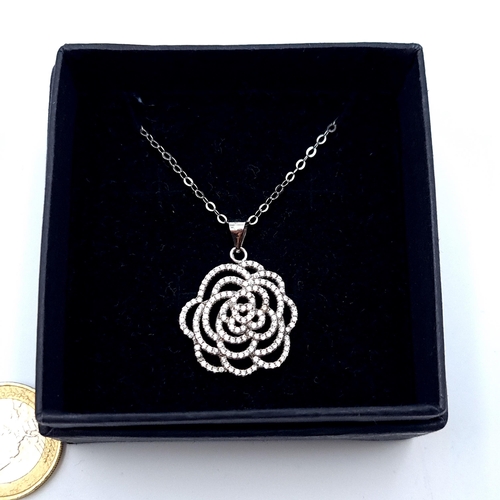 546 - A stunning twist Rose design pendant necklace, with gem set detail and sterling silver chain. Length... 