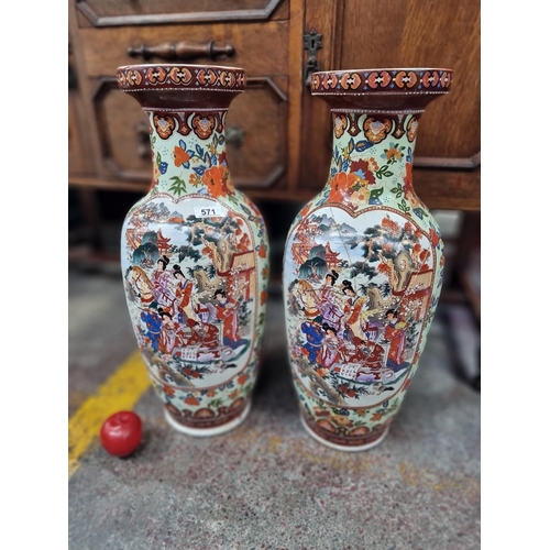 571 - Star Lot : A pair of large Chinese floor vases featuring vibrant traditional scenes and figures in t... 