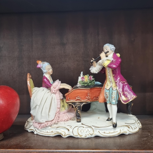 589 - A lovely, vintage large  Dresden musician group, porcelain figure. Depicting a male gentleman flauti... 