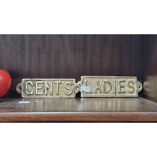 591 - Two heavy, brass wall mounting signs reading ''Ladies'' and ''Gents'' for bathroom signage