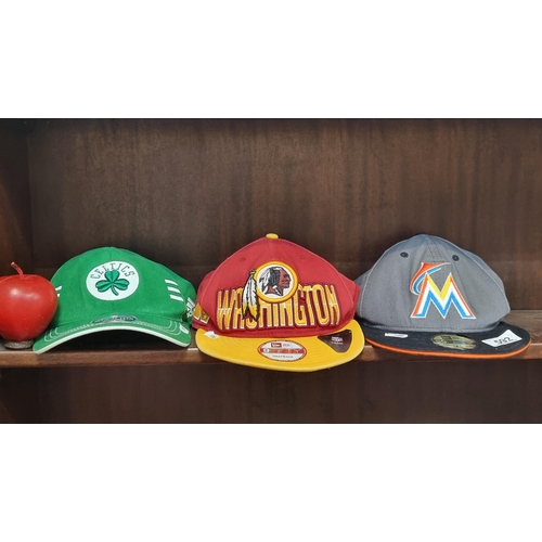 592 - Three stylish hats including two snapback examples and one baseball cap. The latter is a Celtics Add... 