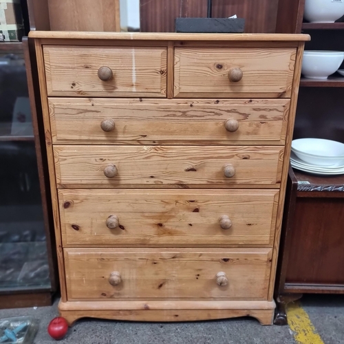 598 - An attractive pine chest of six drawers. A handsome example with two smaller drawers to top and four... 