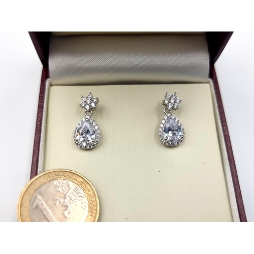 656 - A show stopping pair of Simmonite tear drop earrings, which features pretty star design studs and se... 