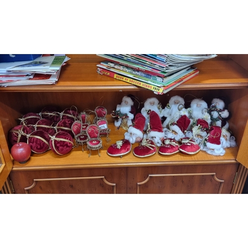 673 - A great selection of twenty-seven Christmas ornaments in the traditional red and gold colour pallet,... 