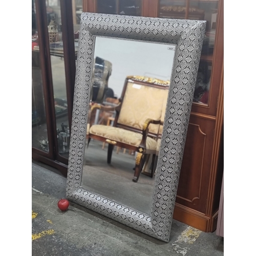 717 - A stunning large bevelled wall hanging mirror with a very ornate pierced frame with a lovely silver ... 