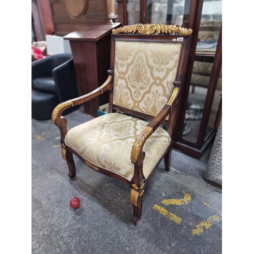 734 - A very large open armed Empire style chair with gilt decoration and damask upholstery. In lovely con... 