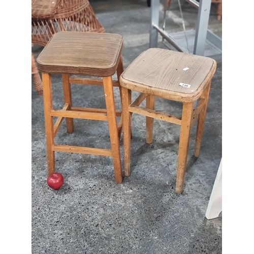 739 - Two charming vintage stools with wooden frame and wood effect plush top.