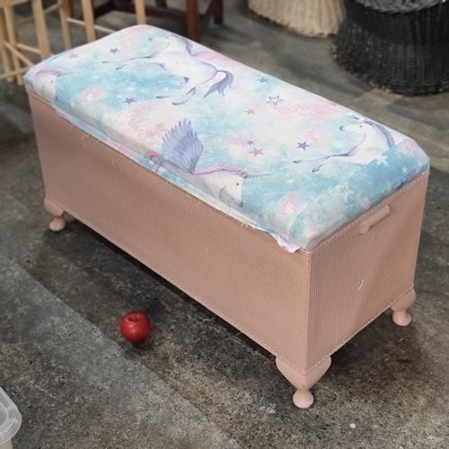 740 - A good sized Lloyd loom Style children's storage bench with unicorn upholstery, and a pink finish ba... 