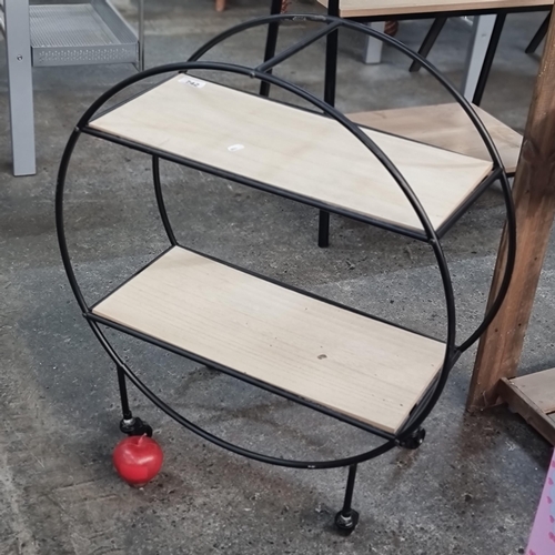 742 - A nice modern display shelf with cast metal circular frame with two wooden shelves  and held on cast... 