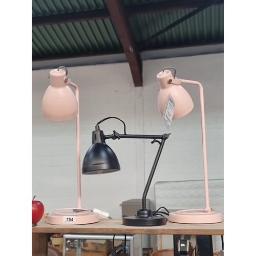 754 - Three retro style metal desk lamps two in a light pink shade and a smaller example in black.