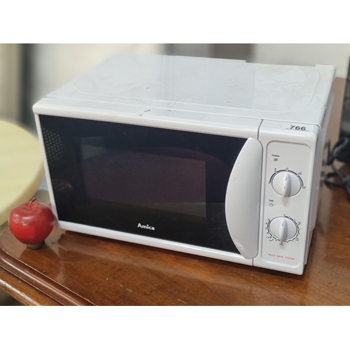 766 - An Amica 700w microwave oven.