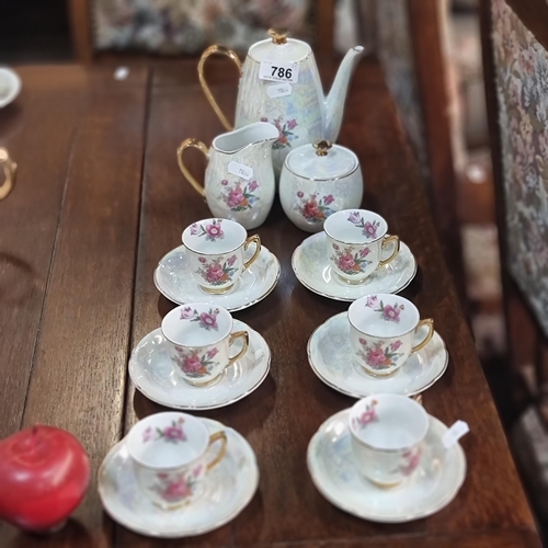 786 - 15 beautiful pieces of porcelain coffee set comprising of cups and saucers, creamer, sugar bowl and ... 