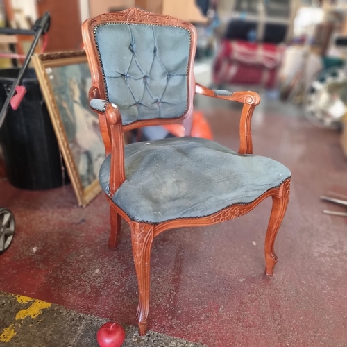 854 - A neat sized Victorian style parlour chair with carved wooden frame and upholstered in a sea green p... 